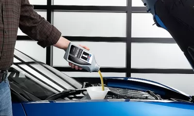 pouring quart oil into car fb og