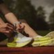 Athlete tying his shoes