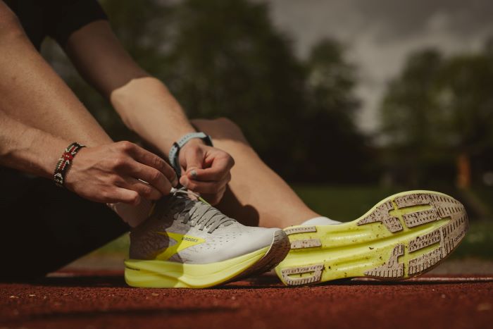 Athlete tying his shoes